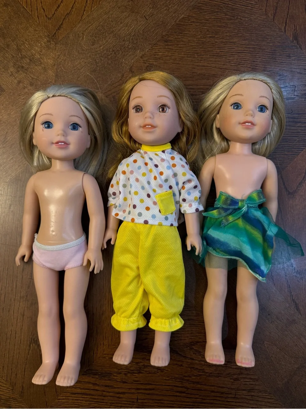 3 American girl-wellie wisher dolls.